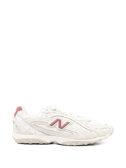 Baskets blanches à panneaux New Balance 1906R 